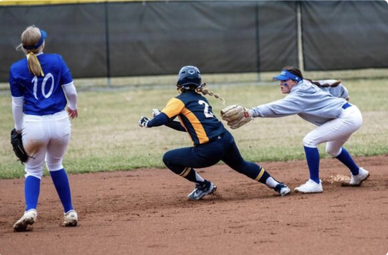 Freshman Kaycie Albers would make an alert defensive play on third base catching a lead runner on a toss to freshman Elise McCann–photo by Reflections by Rob, LLC.