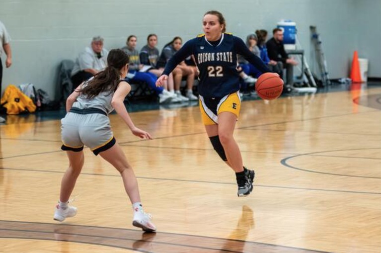 Freshman Emma Garber drives up the court–photo by Reflections by Rob, LLC.
